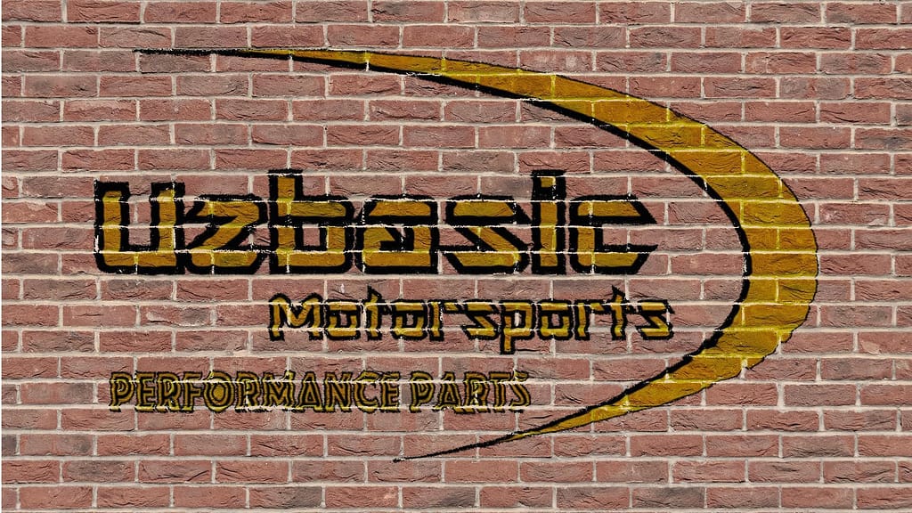 Uzbasic logo on brick wall
